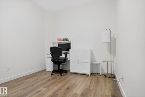 Room featuring light wood-style flooring and white walls - 7344 177 Avenue, Edmonton, AB - Indoor
