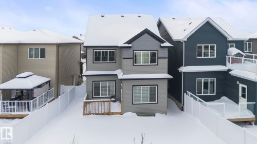 The property features a multi-level exterior with a grey and dark grey color palette, white trim, and a fenced yard - 7344 177 Avenue, Edmonton, AB - Outdoor With Facade