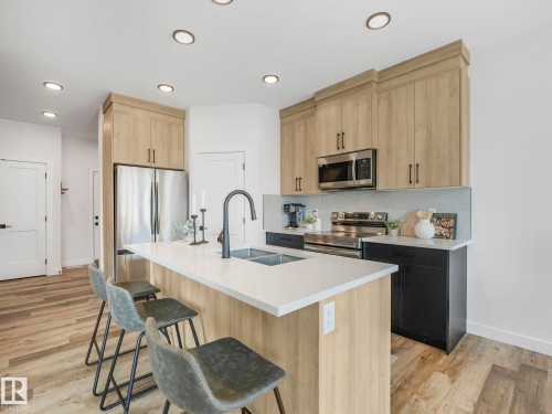 201 Starling, Fort Saskatchewan, AB - Indoor Photo Showing Kitchen With Double Sink With Upgraded Kitchen