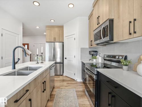 201 Starling, Fort Saskatchewan, AB - Indoor Photo Showing Kitchen With Double Sink With Upgraded Kitchen