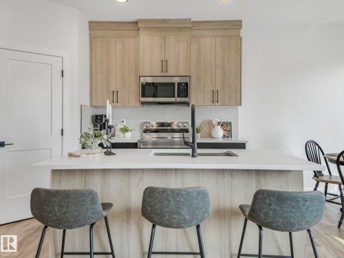 201 Starling, Fort Saskatchewan, AB - Indoor Photo Showing Kitchen With Upgraded Kitchen