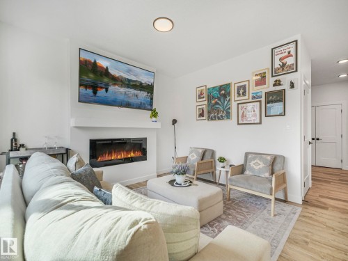 201 Starling, Fort Saskatchewan, AB - Indoor Photo Showing Living Room With Fireplace