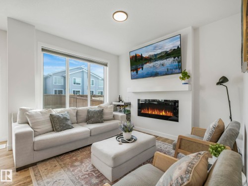 201 Starling, Fort Saskatchewan, AB - Indoor Photo Showing Living Room With Fireplace