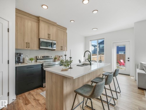 201 Starling, Fort Saskatchewan, AB - Indoor Photo Showing Kitchen With Double Sink