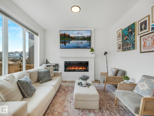 201 Starling, Fort Saskatchewan, AB - Indoor Photo Showing Living Room With Fireplace