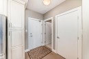 Entryway featuring light-colored walls, white doors, and a ceiling-mounted light fixture - 506 11080 Ellerslie Road, Edmonton, AB  - Indoor Photo Showing Other Room 