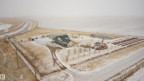 The property features a main house with a porch and several outbuildings, including a shed - 114039 Range Road 221, Rural Lethbridge County, AB -  With View