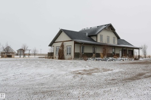 The property features an extensive gravel yard and a gazebo - 114039 Range Road 221, Rural Lethbridge County, AB - Outdoor