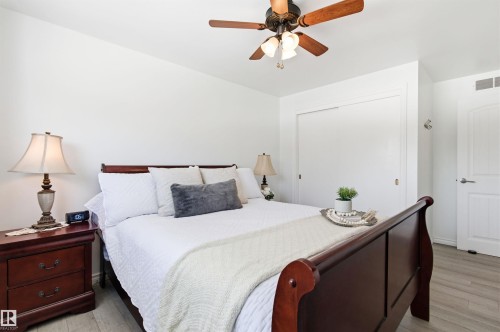 This room features light-colored flooring, white walls, and a ceiling fan with integrated lighting - 12904 95 Street, Edmonton, AB - Indoor Photo Showing Bedroom