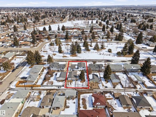 This aerial view showcases the property within a well-established residential neighborhood, characterized by a mix of single-story and multi-story homes - 12904 95 Street, Edmonton, AB - Outdoor With View