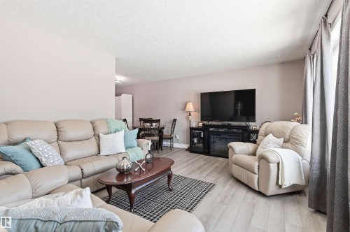 Living room with light-colored walls and light-toned flooring - 12904 95 Street, Edmonton, AB - Indoor Photo Showing Living Room