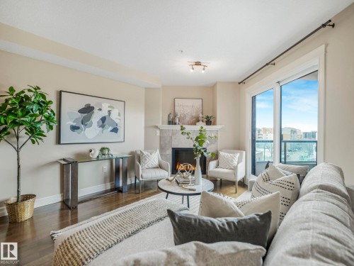 511 10142 111 Street, Edmonton, AB - Indoor Photo Showing Living Room With Fireplace
