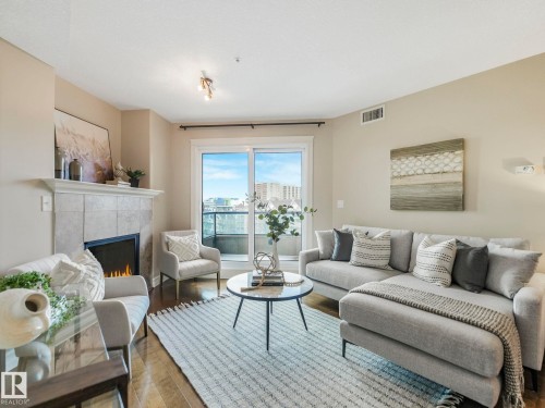 511 10142 111 Street, Edmonton, AB - Indoor Photo Showing Living Room With Fireplace