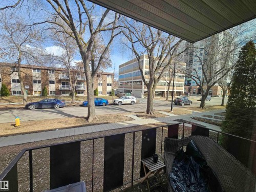 The property features a balcony with a black metal railing - 8 10616 123 Street, Edmonton, AB - Outdoor