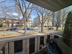 The property features a balcony with a black metal railing - 