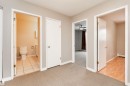 Hallway with neutral carpeting and light gray walls - 8 10616 123 Street, Edmonton, AB  - Indoor 