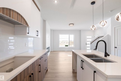 463 Bank Wynd, Leduc, AB - Indoor Photo Showing Kitchen With Double Sink With Upgraded Kitchen