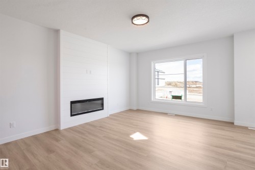 463 Bank Wynd, Leduc, AB - Indoor Photo Showing Living Room With Fireplace