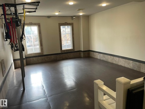 This versatile space features two windows, recessed lighting, and a durable flooring surface - Edmonton, AB - Indoor Photo Showing Other Room