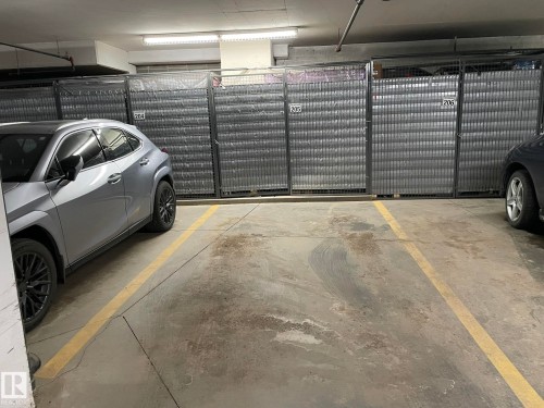 Dedicated parking space within an indoor parking area - Edmonton, AB - Indoor Photo Showing Garage