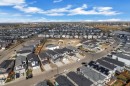 Aerial view of the property and surrounding neighborhood, featuring a residential area with a lake - 12 Dalquist Bay, Leduc, AB  - Outdoor With View 