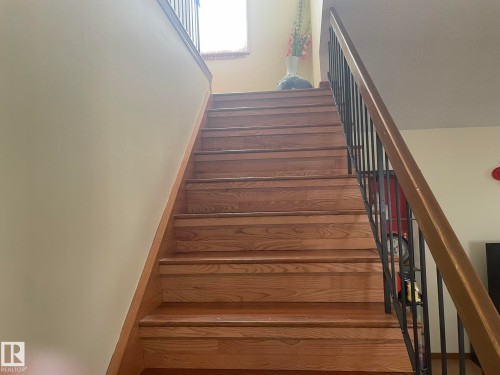 Hardwood staircase featuring wood-finish treads and risers - 9320 175 Street, Edmonton, AB - Indoor Photo Showing Other Room