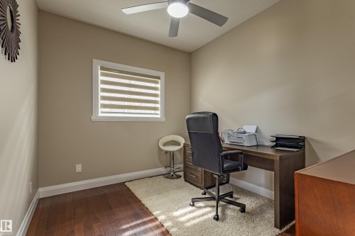 This room features hardwood floors, a window with blinds, and a ceiling fan - 3611 14 Street, Edmonton, AB - Indoor Photo Showing Office