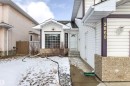 The property features a white exterior with dark trim and a large front window - 3668 31A Street, Edmonton, AB  - Outdoor 