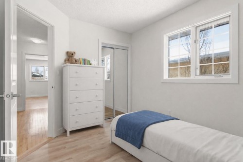 This room features light-colored flooring and white walls, creating a bright and airy atmosphere - 3668 31A Street, Edmonton, AB - Indoor Photo Showing Bedroom