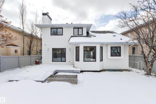 The property features white siding and dark-framed windows, with a bay window design on one exterior wall - 3668 31A Street, Edmonton, AB - Outdoor