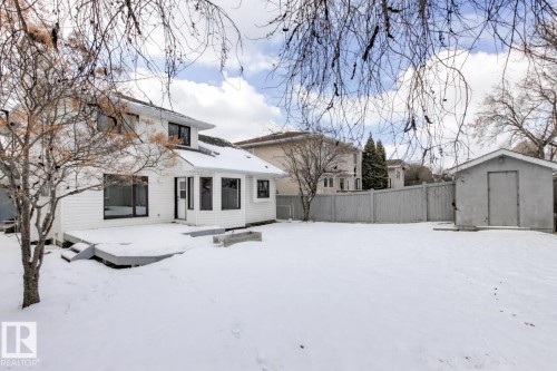 The property features a spacious rear yard with a shed and a privacy fence - 3668 31A Street, Edmonton, AB - Outdoor