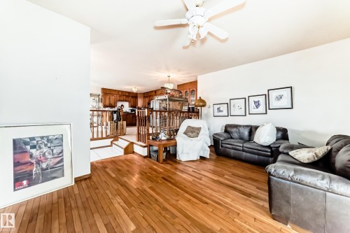 Hardwood flooring throughout the main living area - 208 Willow Crescent, Wetaskiwin, AB - Indoor Photo Showing Living Room