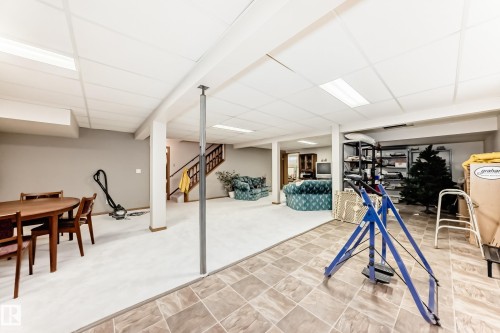 Spacious lower level featuring a combination of soft flooring and patterned tile - 208 Willow Crescent, Wetaskiwin, AB - Indoor