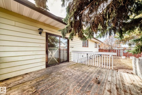 Outdoor wooden deck with white railing - 208 Willow Crescent, Wetaskiwin, AB - Outdoor With Exterior