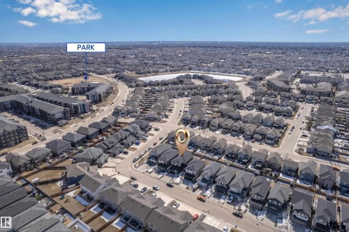 This aerial view showcases the property within a well-developed neighborhood, featuring numerous residential properties with dark roofs - 7815 174 Avenue, Edmonton, AB - Outdoor With View