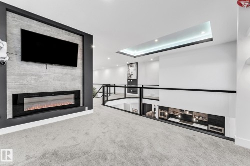 3130 Kostash Green, Edmonton, AB - Indoor Photo Showing Other Room With Fireplace