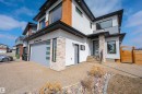 The property features a modern exterior with a light-colored stucco finish and wood accents - 3130 Kostash Green, Edmonton, AB  - Outdoor 