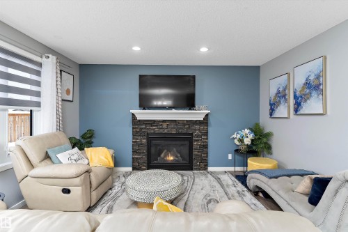 4294 126A Avenue, Edmonton, AB - Indoor Photo Showing Living Room With Fireplace
