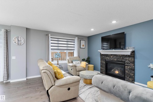 4294 126A Avenue, Edmonton, AB - Indoor Photo Showing Living Room With Fireplace