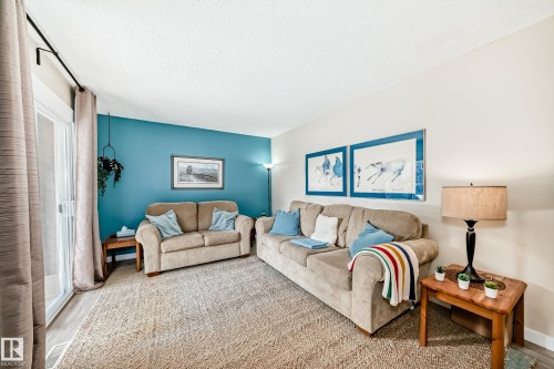 8113 27 Avenue, Edmonton, AB - Indoor Photo Showing Living Room
