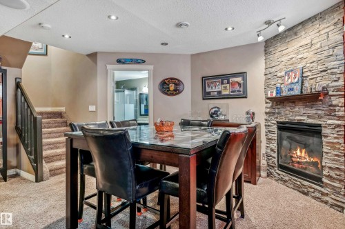 21 Hillcrest Point(E), Fort Saskatchewan, AB - Indoor Photo Showing Dining Room With Fireplace