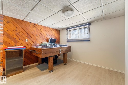 Finished room featuring wood-finish flooring and a drop ceiling - 25750 18 Street, Edmonton, AB - Indoor Photo Showing Other Room