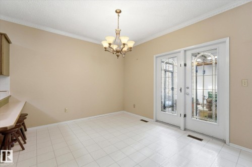 Dining area featuring white ceramic tile flooring and light beige walls - 25750 18 Street, Edmonton, AB - Indoor Photo Showing Other Room