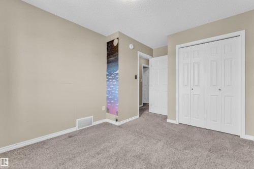 Light-colored wall finishes complementing plush carpet flooring - 2526 19A Avenue, Edmonton, AB - Indoor
