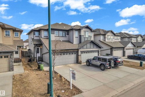 Two-story residence featuring a dual-tone exterior with light and dark gray siding - 2526 19A Avenue, Edmonton, AB - Outdoor With Facade