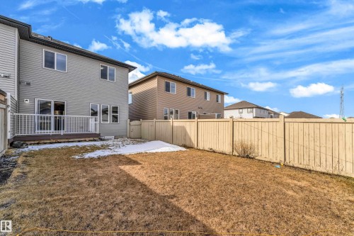 Rear exterior with siding finish and white-trimmed windows - 2526 19A Avenue, Edmonton, AB - Outdoor With Deck Patio Veranda With Exterior