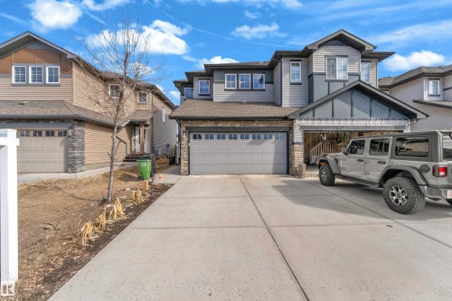 Contemporary multi-story exterior with horizontal siding and stone accents - 2526 19A Avenue, Edmonton, AB - Outdoor With Facade