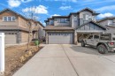 Contemporary multi-story exterior with horizontal siding and stone accents - 2526 19A Avenue, Edmonton, AB  - Outdoor With Facade 