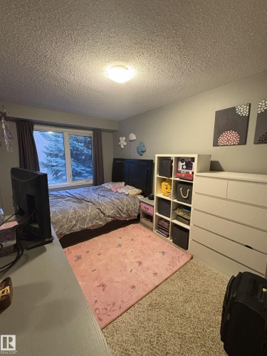 Bedroom featuring carpet flooring and a window with privacy drapes - 79 Akinsdale Gardens, St. Albert, AB - Indoor Photo Showing Bedroom