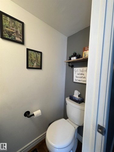 White toilet with a white tank and round bowl - 79 Akinsdale Gardens, St. Albert, AB - Indoor Photo Showing Bathroom